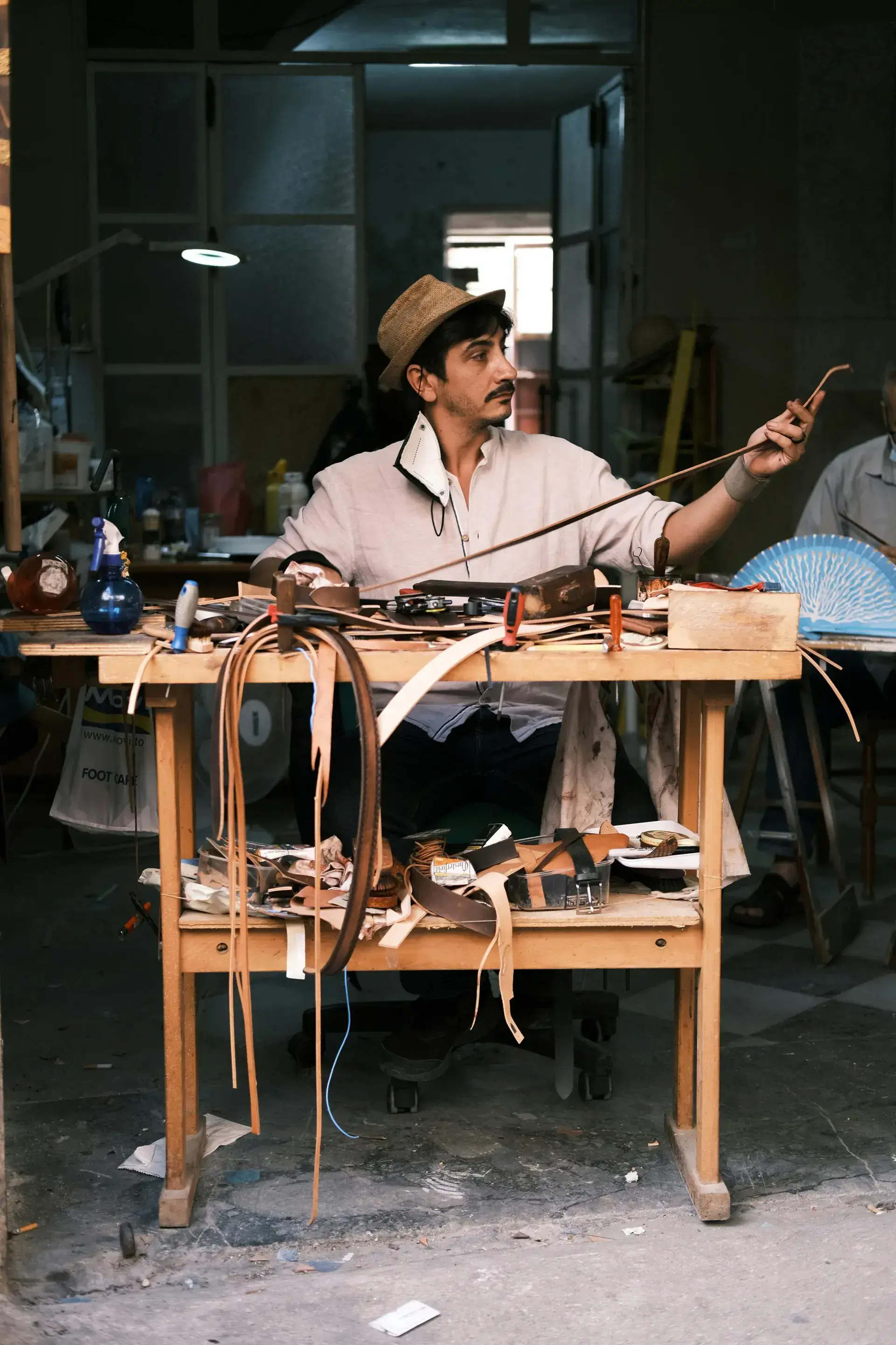 Leather craftsman at work in his workshop